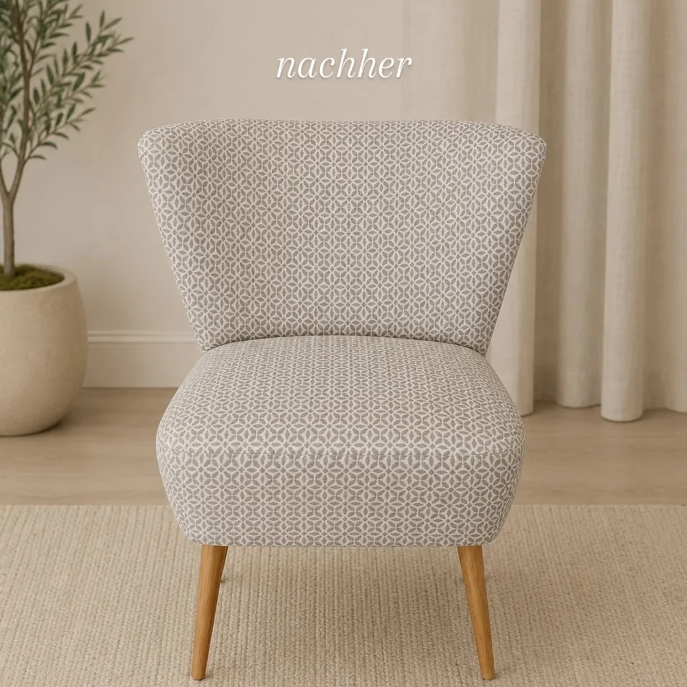 Derselbe Cocktailsessel, aufgearbeitet und mit hellem Musterstoff neu bezogen